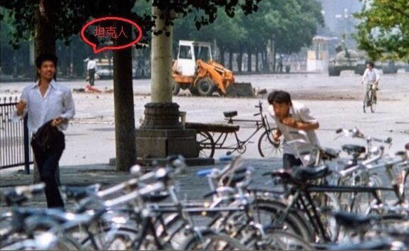 Three unidentified men in front of approaching tanks in Tiananmen Square, China